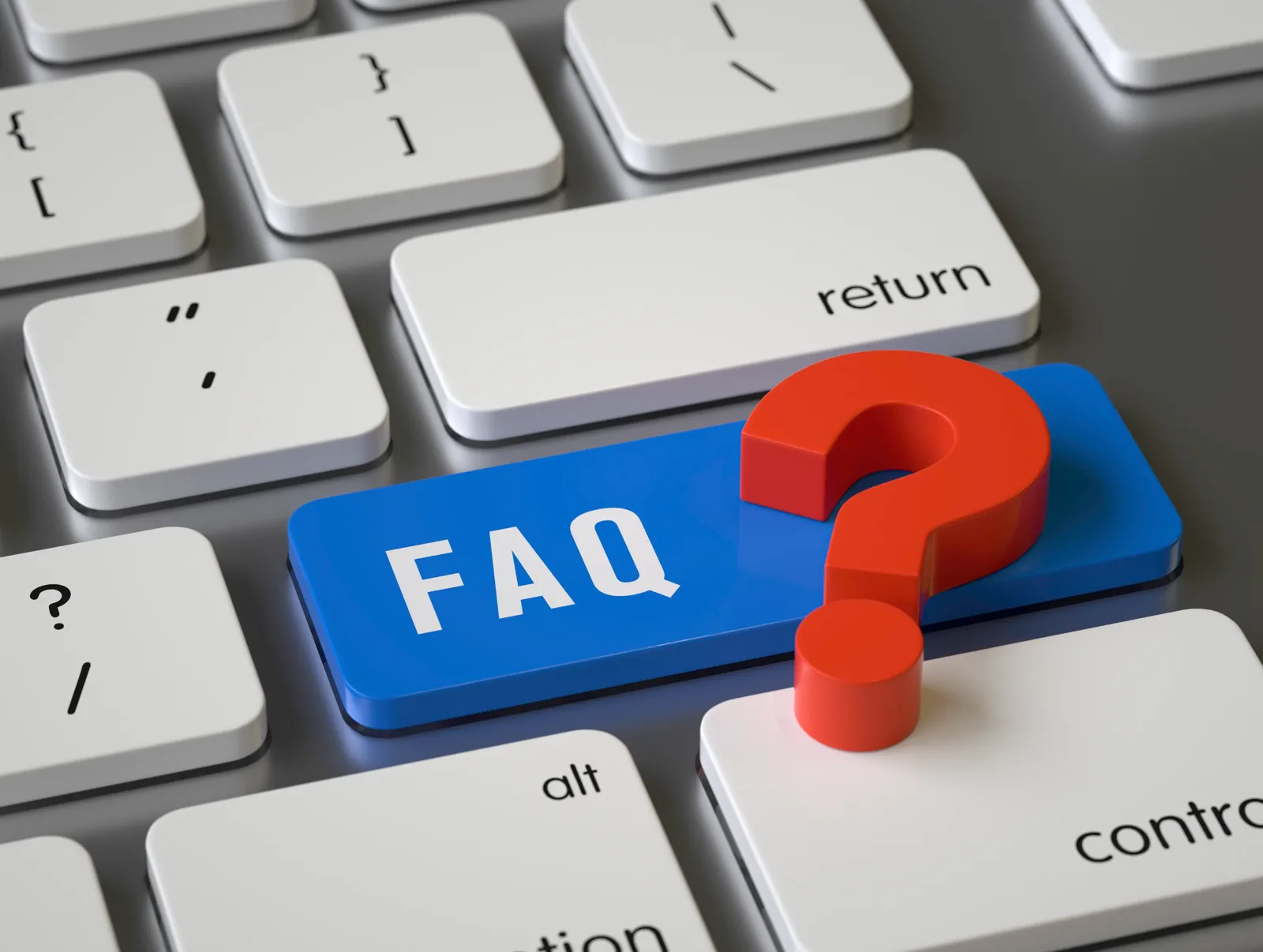 A computer keyboard with one key highlighted in blue and marked FAQ, alongside a red question mark.